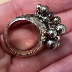 Sterling silver (925) ring with tiny silver balls that move.
